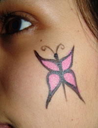 How To Face Paint A Small Butterfly Craftbits Com Over the light blue face paint, add purple face paint over the eyebrows and cheeks with a medium brush. how to face paint a small butterfly