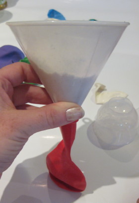Use the funnel to add flour